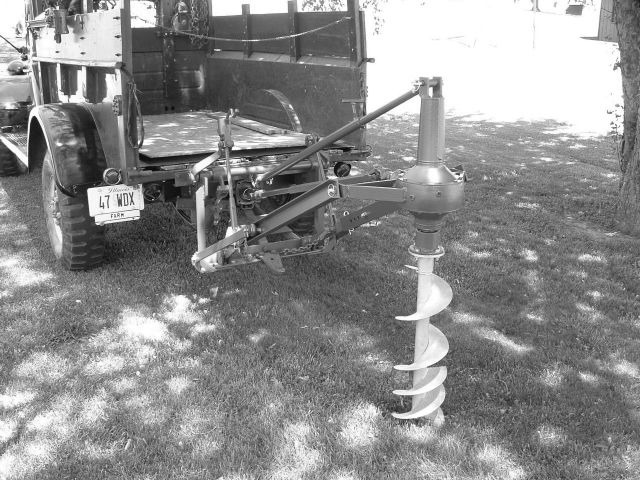 post-hole auger driven off the truck
