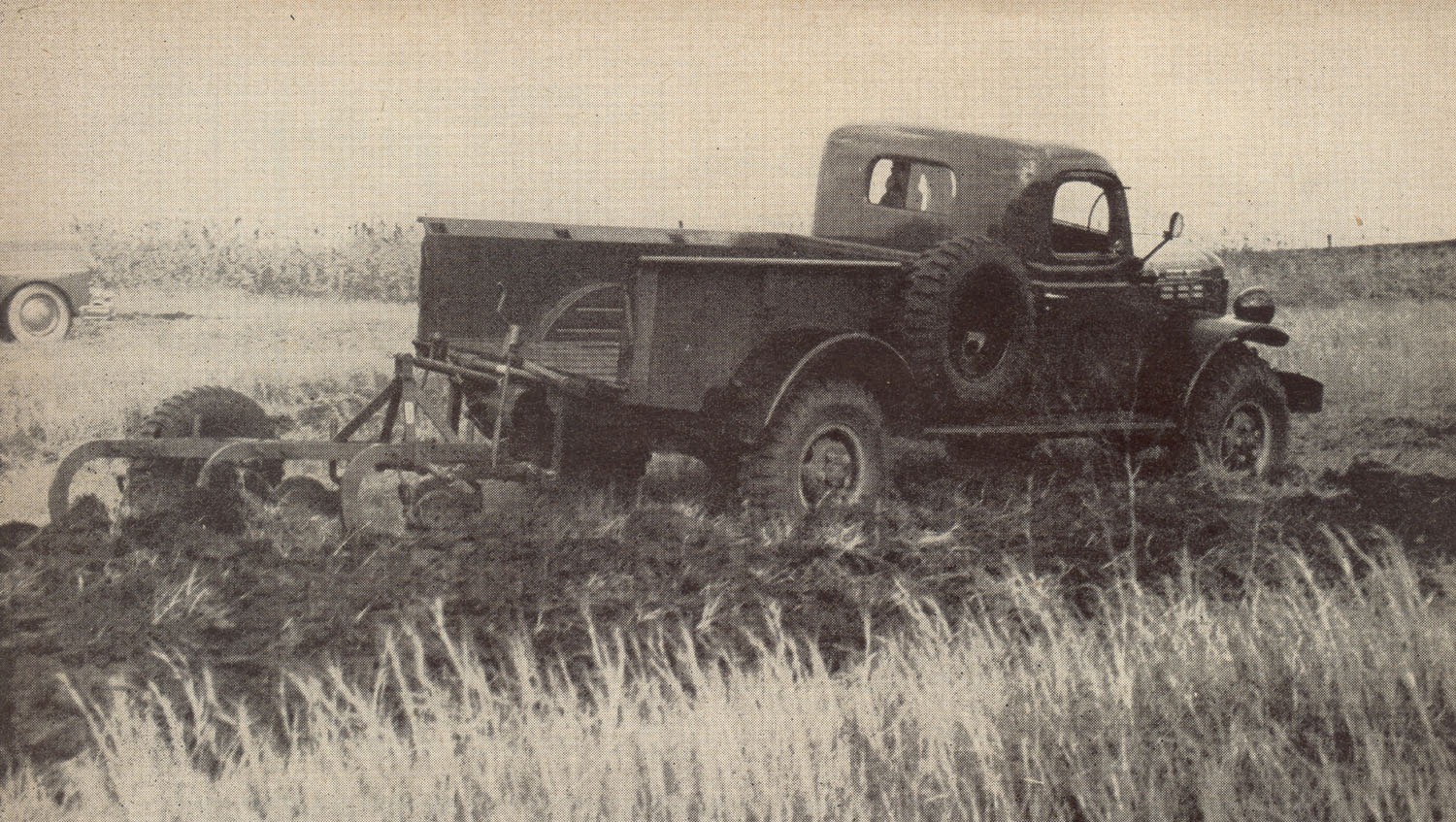 Power Wagon plowing a field